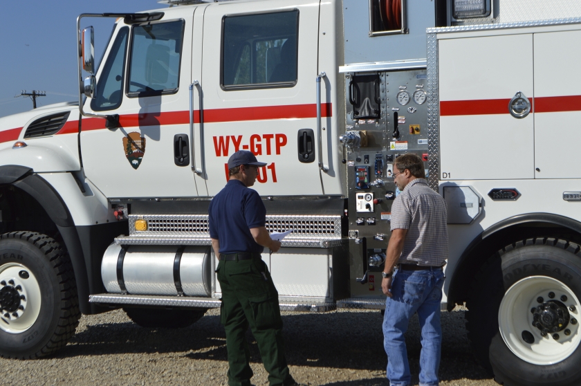 Bill Yohn inspects a fire safety vehicle at the National Interagency Fire Center