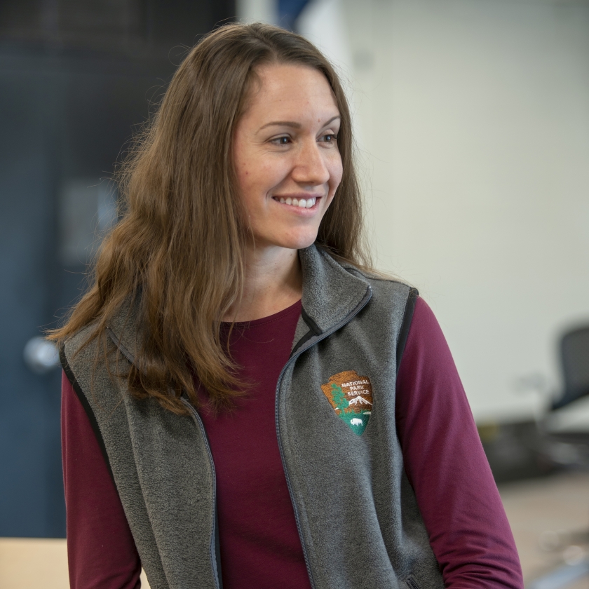 Visual Information Specialist Laura Thomas poses for a photo in her office